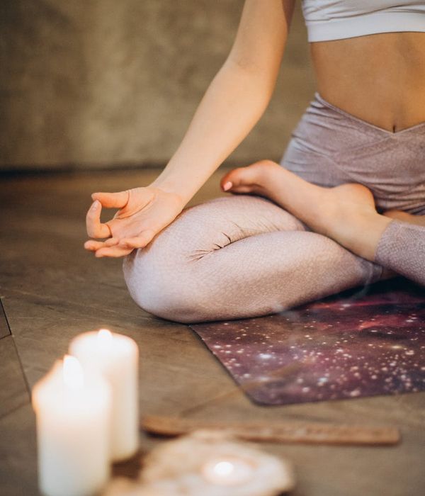 Woman in a calm yoga pose, embodying balance and serenity.